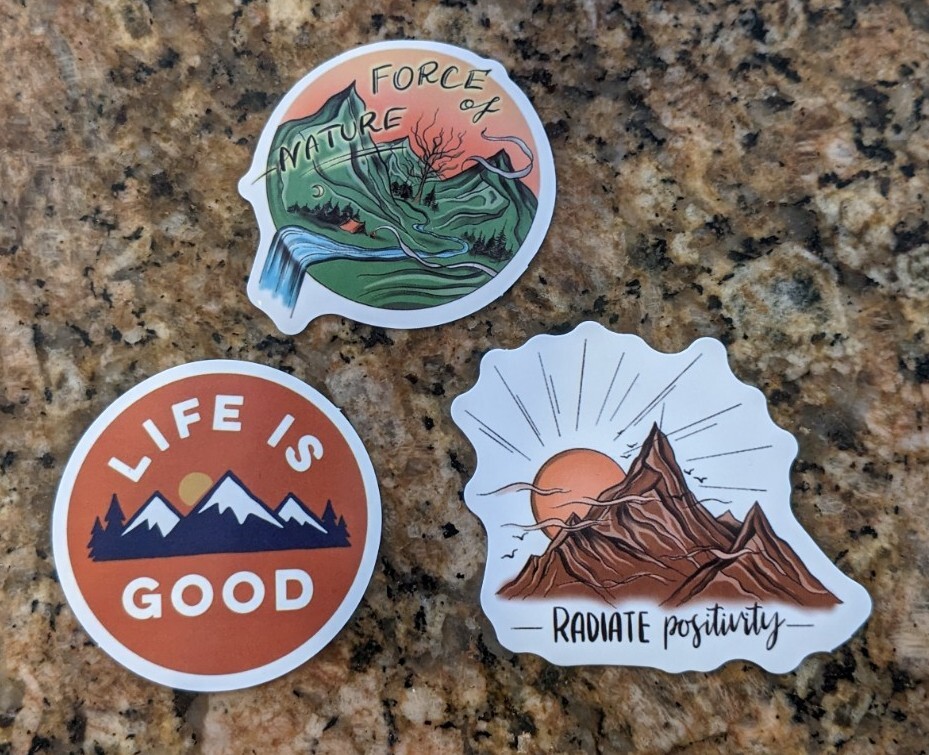 A set of Life is Good Radiate Positivity Camping Outdoor Sticker Decals