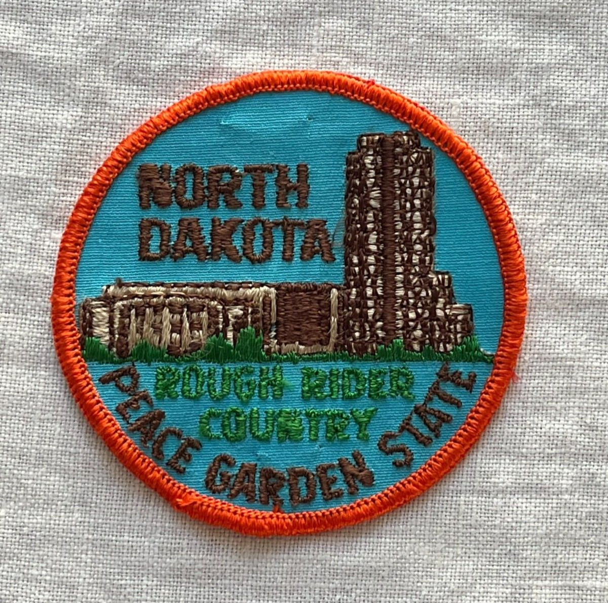 NORTH DAKOTA 2 STATE TRAVEL SOUVENIR COLLECTIBLE PATCHES ROUGH RIDER COUNTRY
