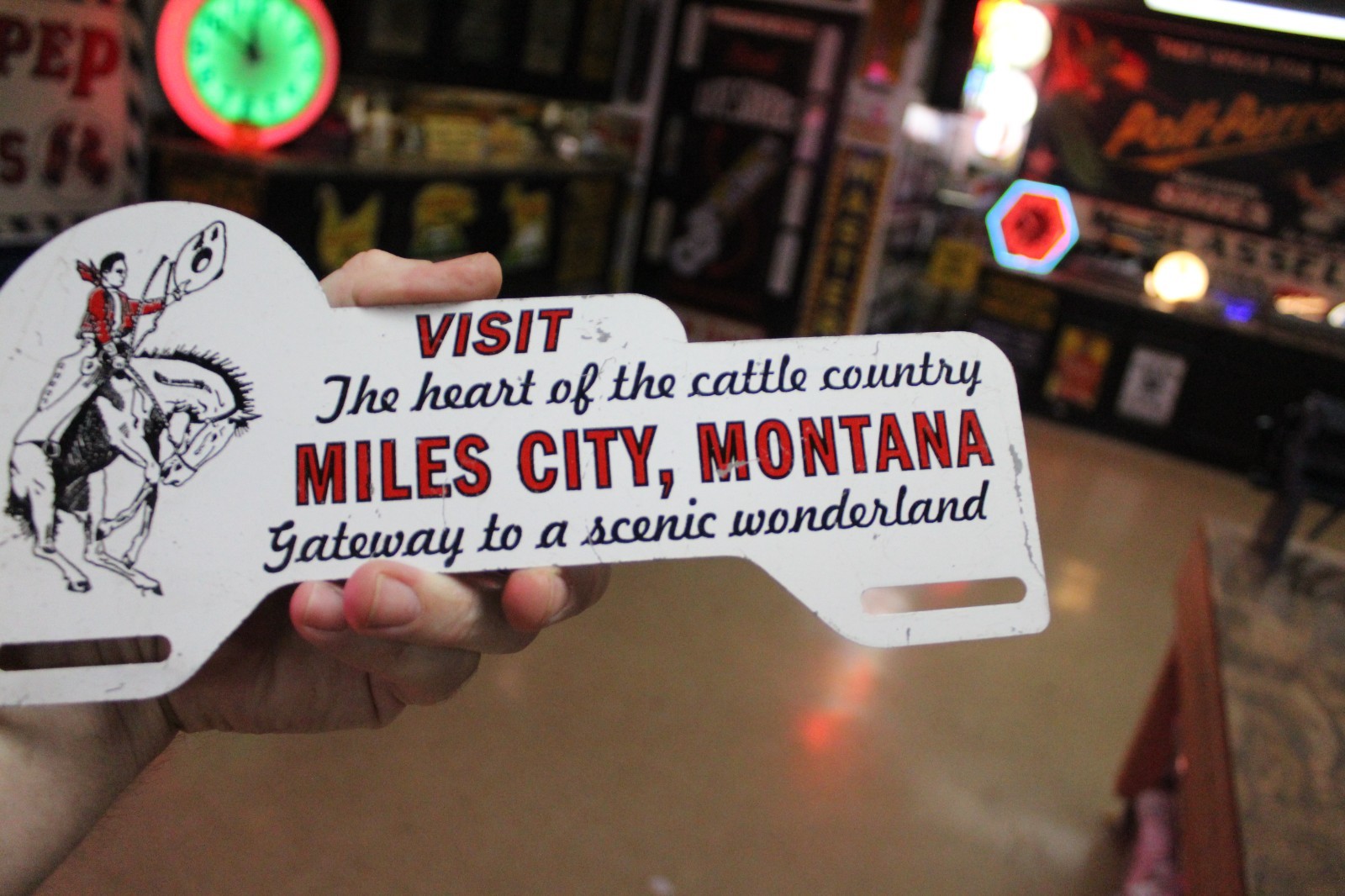 RARE 1950s MILES CITY MONTANA STAMPED PAINTED METAL TOPPER SIGN COWBOY HORSE