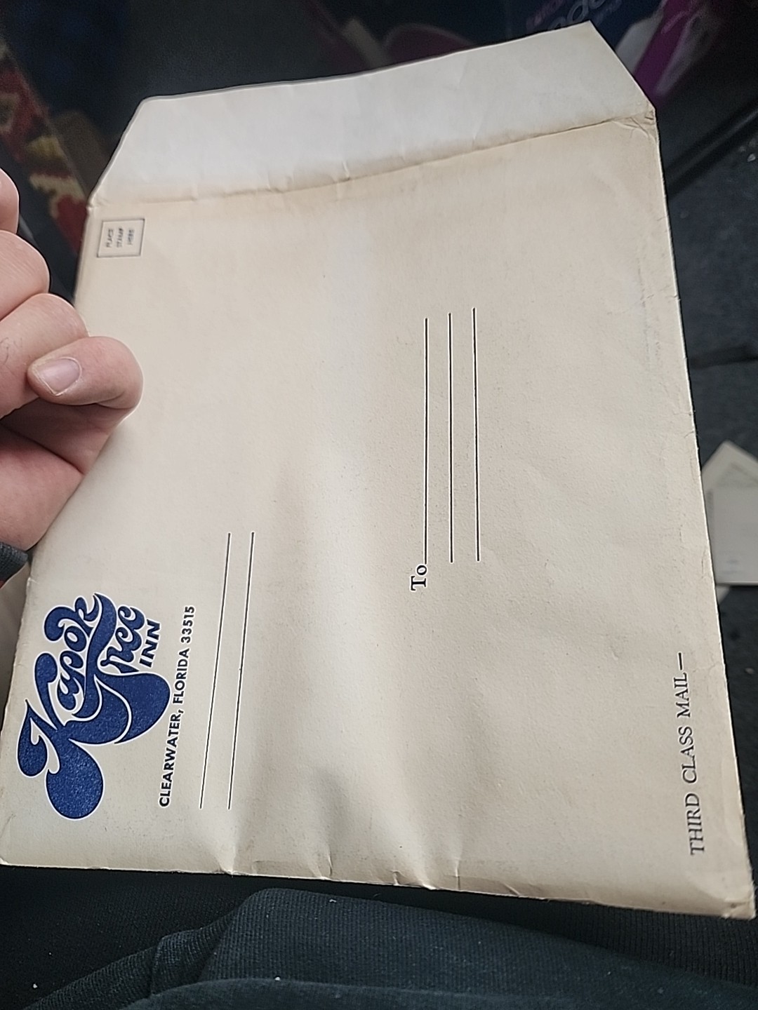 bronze kapok tree souvenir token dated 1973 and booklet from the restaurant