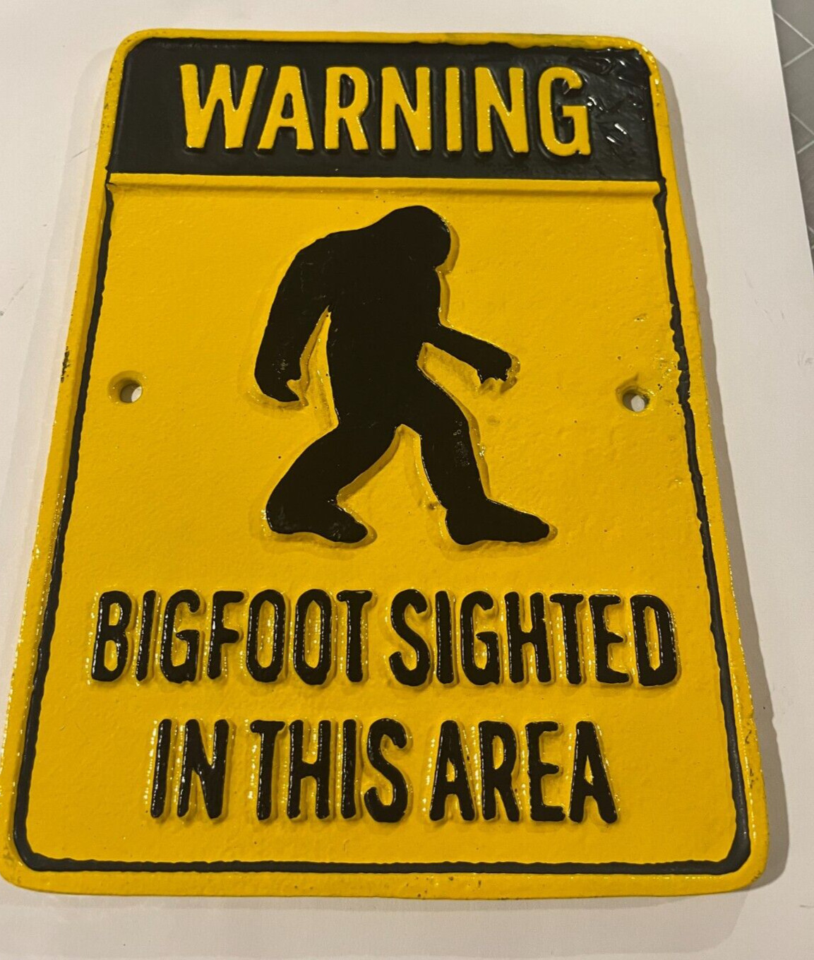 Warning Bigfoot Sighted in this Area Cast iron Sign. 9″ x 6 3/8″, Yellow Black