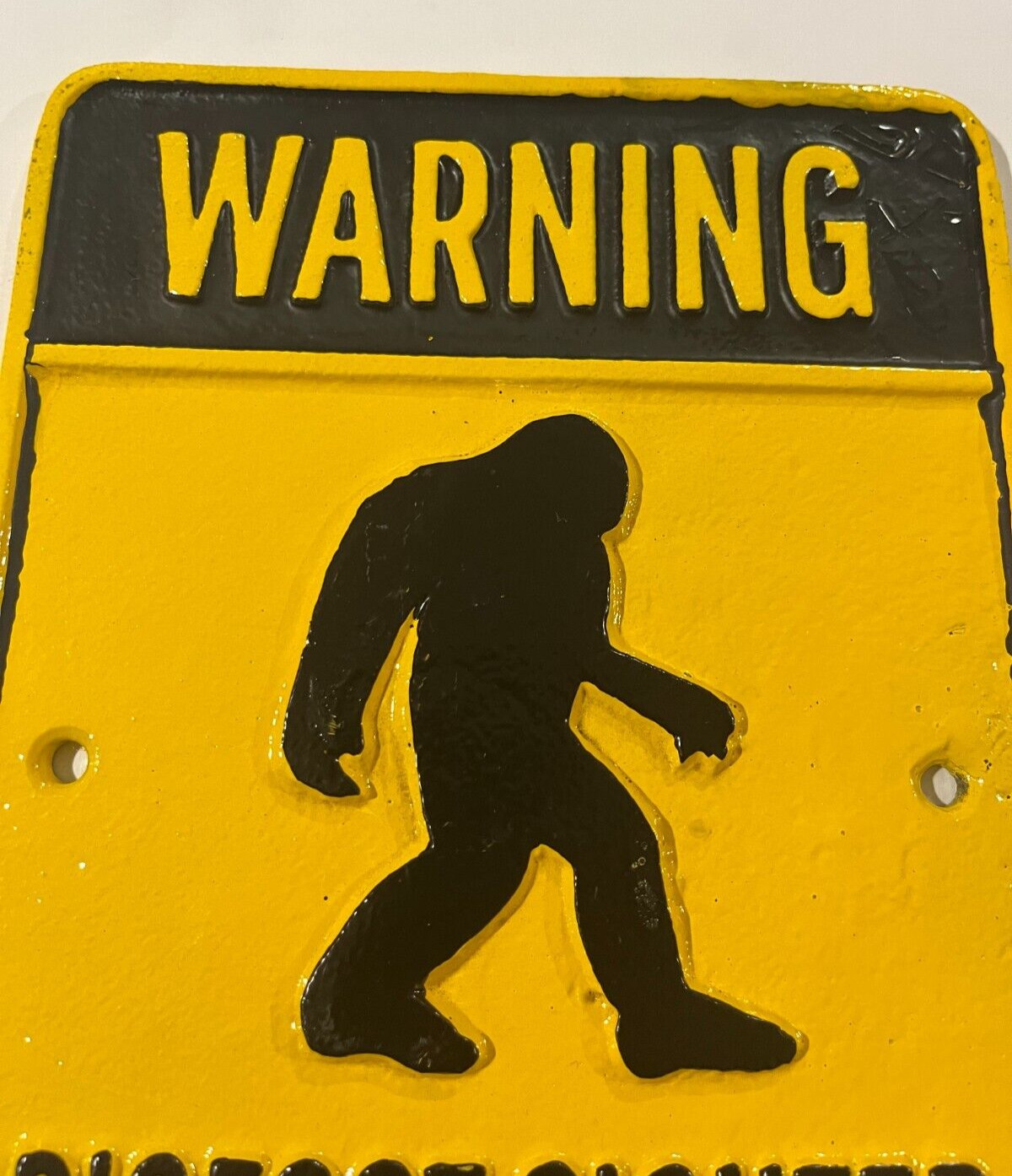 Warning Bigfoot Sighted in this Area Cast iron Sign. 9″ x 6 3/8″, Yellow Black