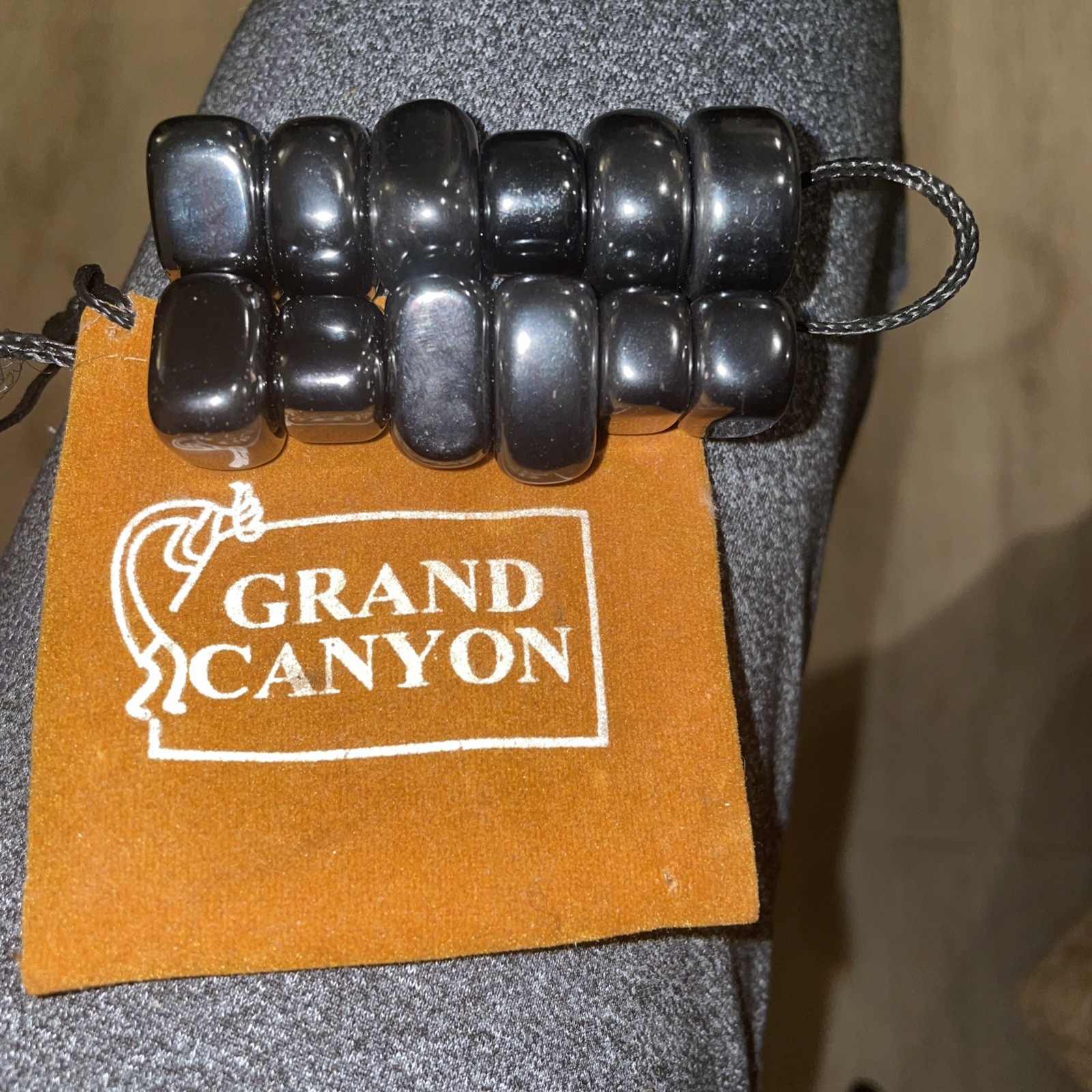 12 Smooth Hematite Magnets In Grand Canyon Suede Bag