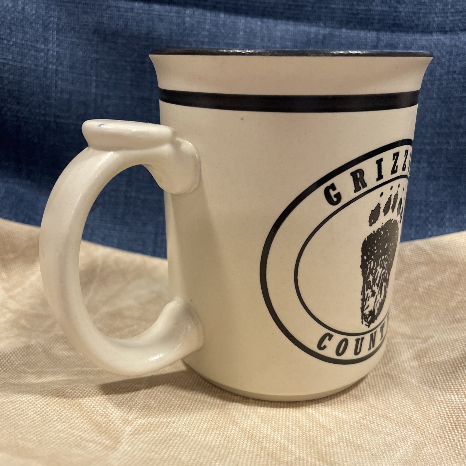 Grizzly Country Yellowstone National Park Mug Blue/black/cream Bear & Paw Print