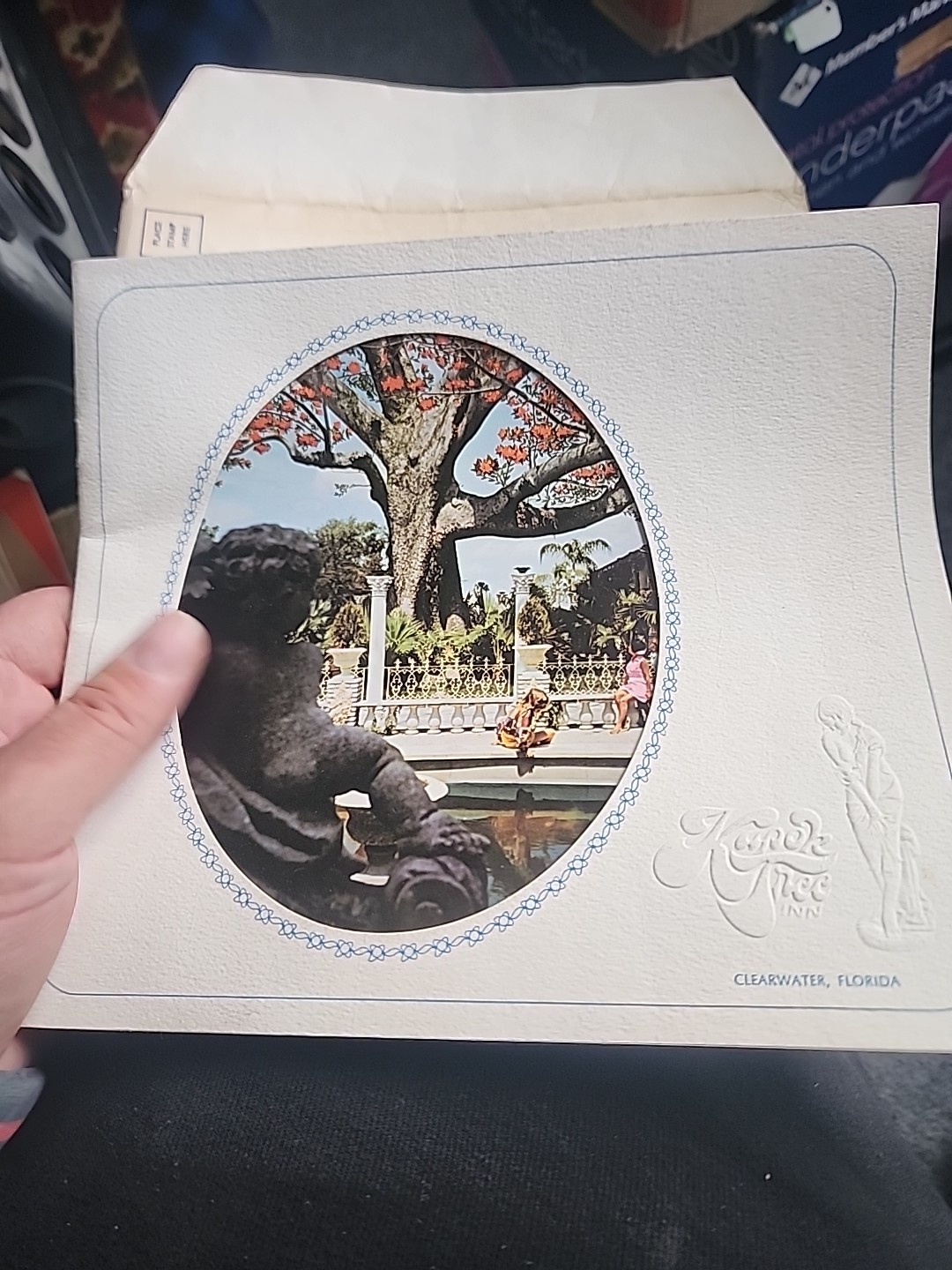 bronze kapok tree souvenir token dated 1973 and booklet from the restaurant