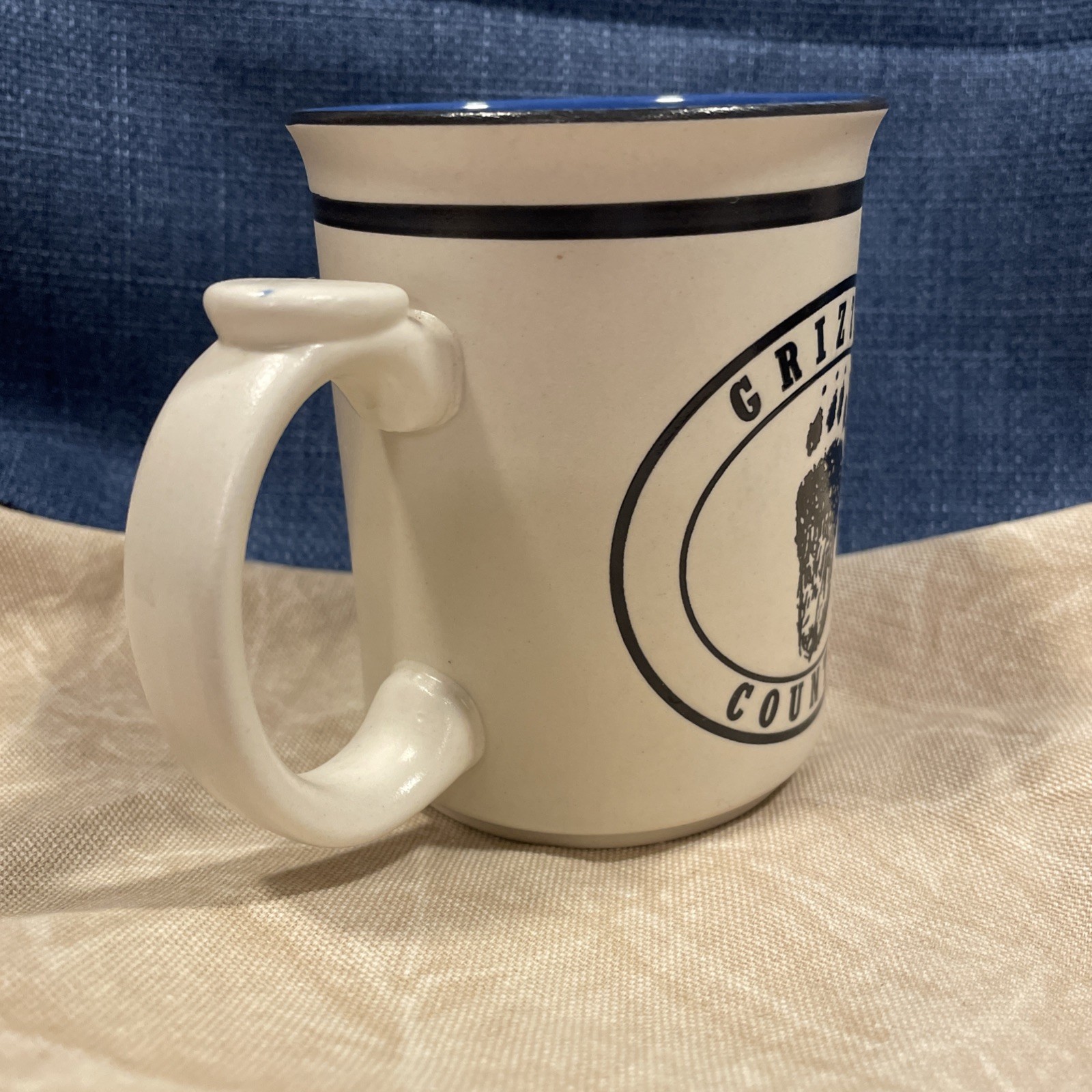 Grizzly Country Yellowstone National Park Mug Blue/black/cream Bear & Paw Print